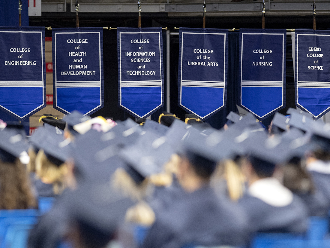 Graduates gather during a commencement ceremony.