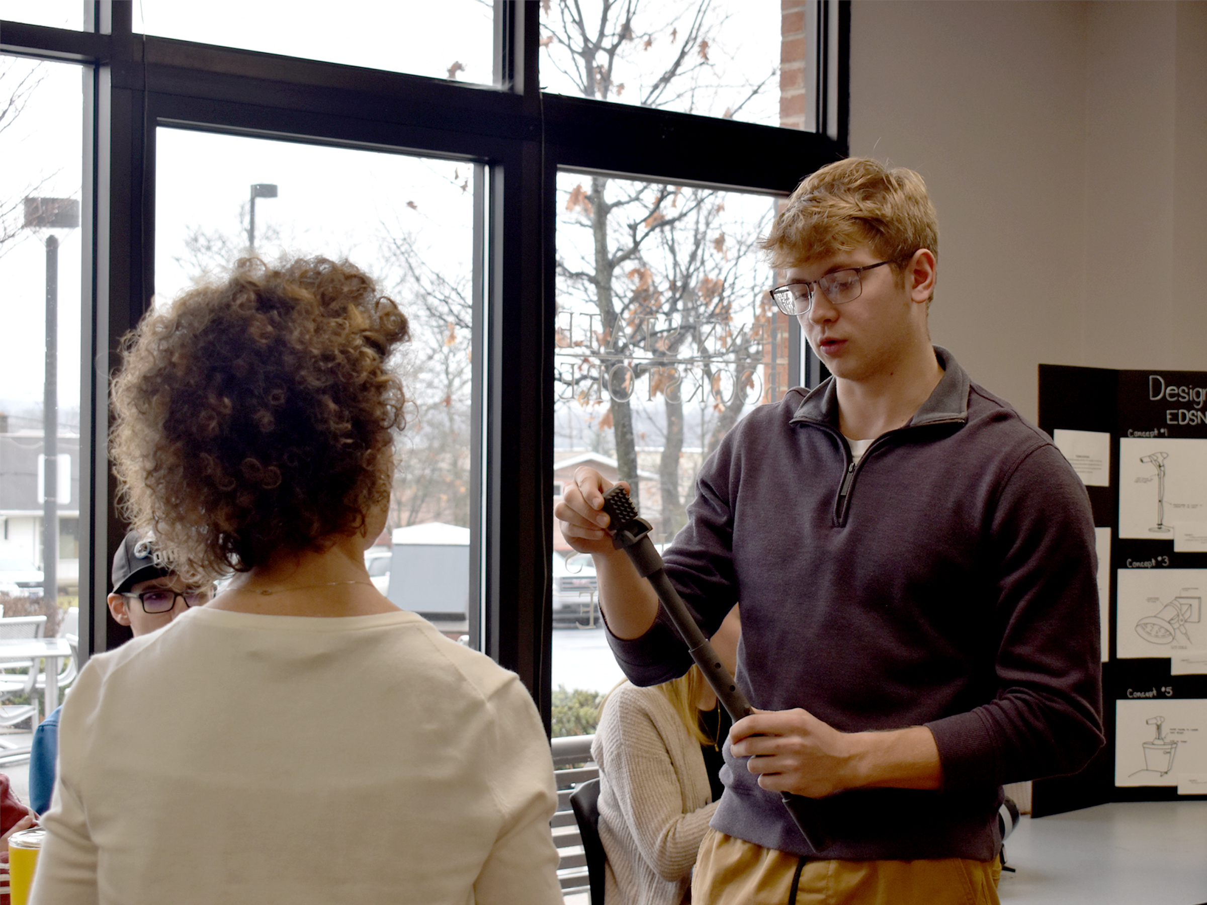 Jalen Kosko, Penn State DuBois freshman mechanical engineering student, presents the prototype for his group at the collaboration projects presentation