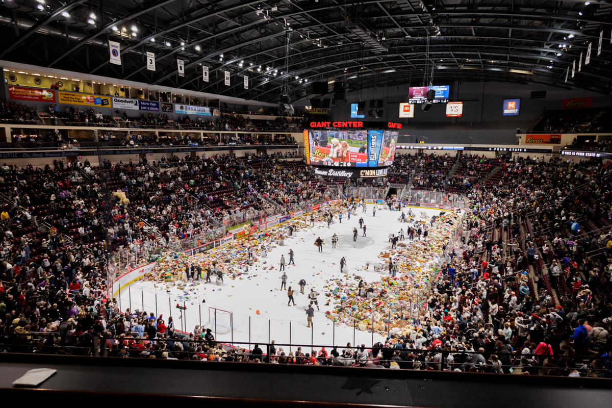 Thousands of teddy bears sit on the ice at an ice hockey game