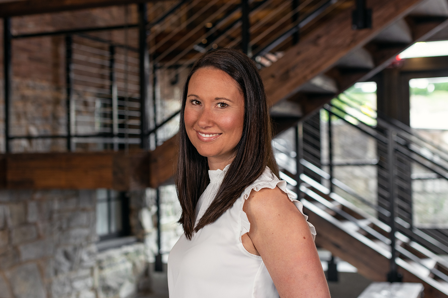 Aliana Steinbugl wearing white with stairs in the background