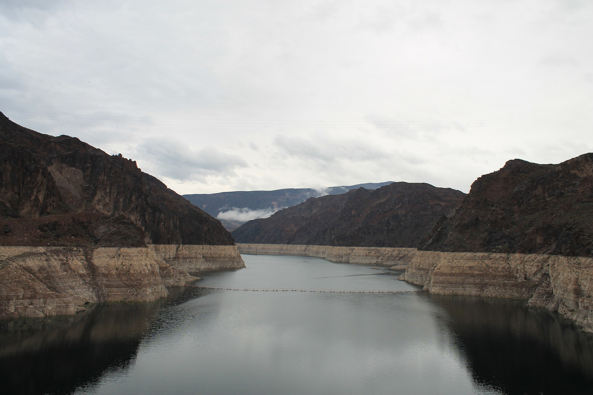 An image of Lake Mead that shows a white line indicating how far the water level has dropped 