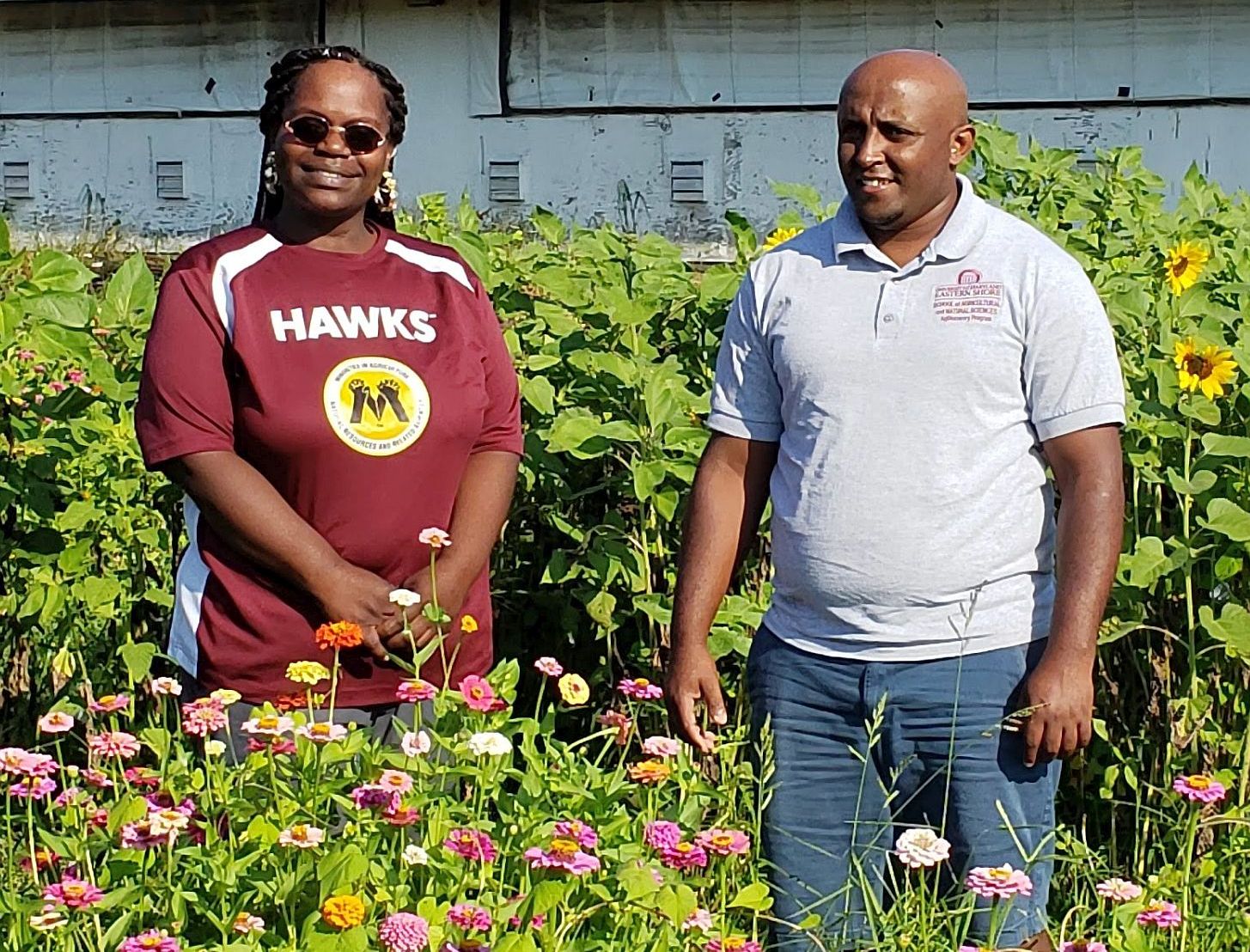 Ebony Jenkins and Simon Zebelo, of UMES, in a field research plot