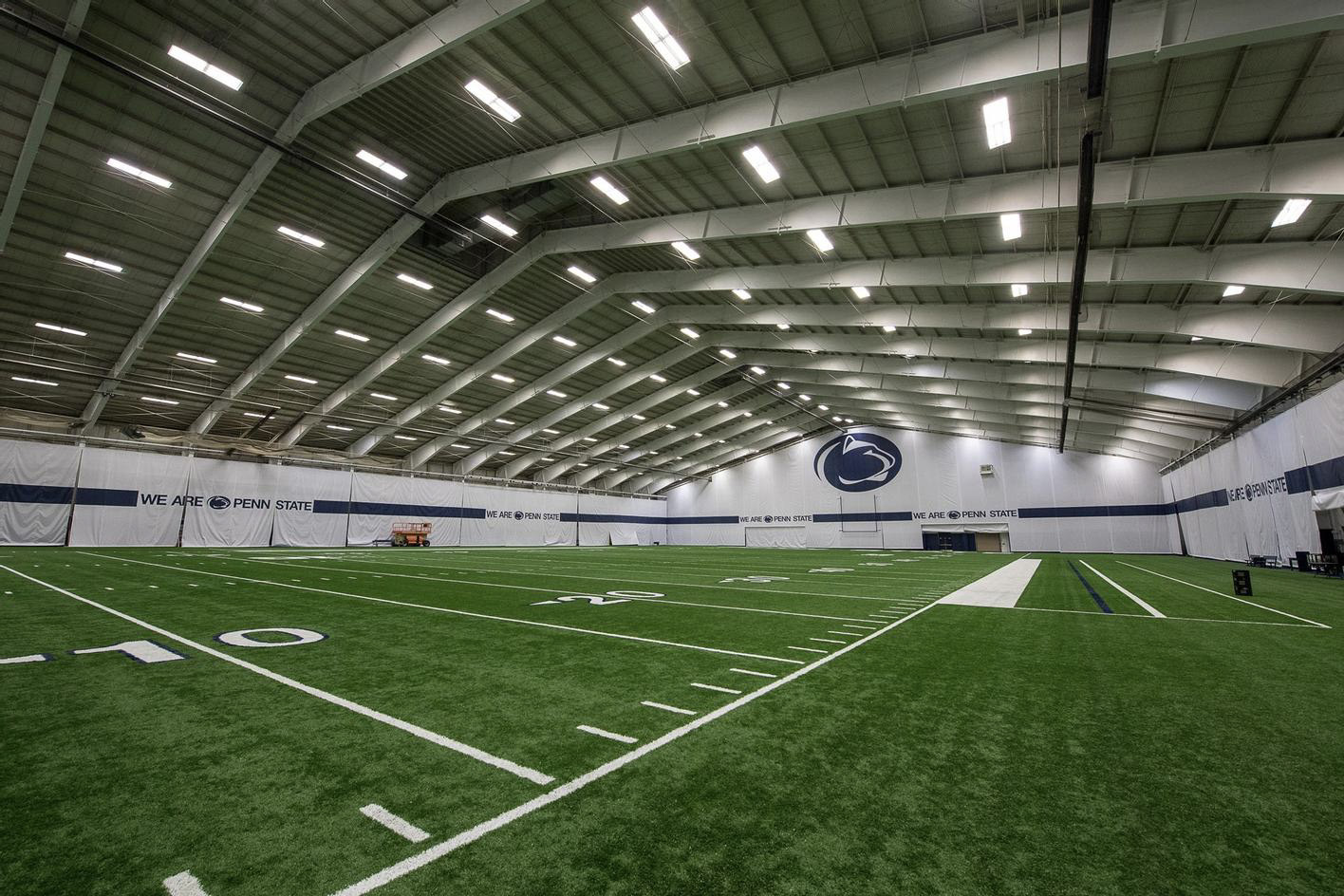 An interior view of an indoor football practice facility.