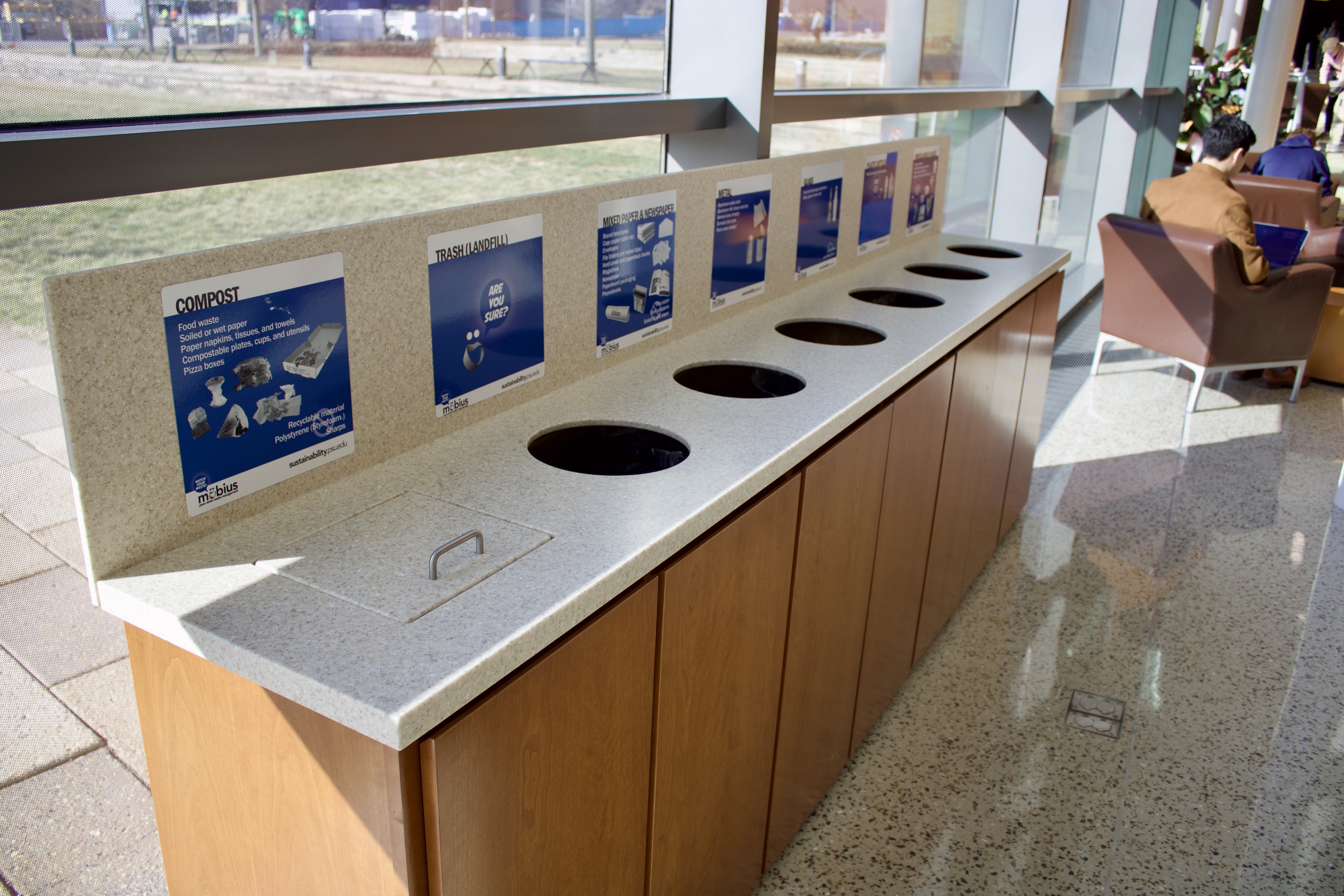 Waste collection station inside building lobby