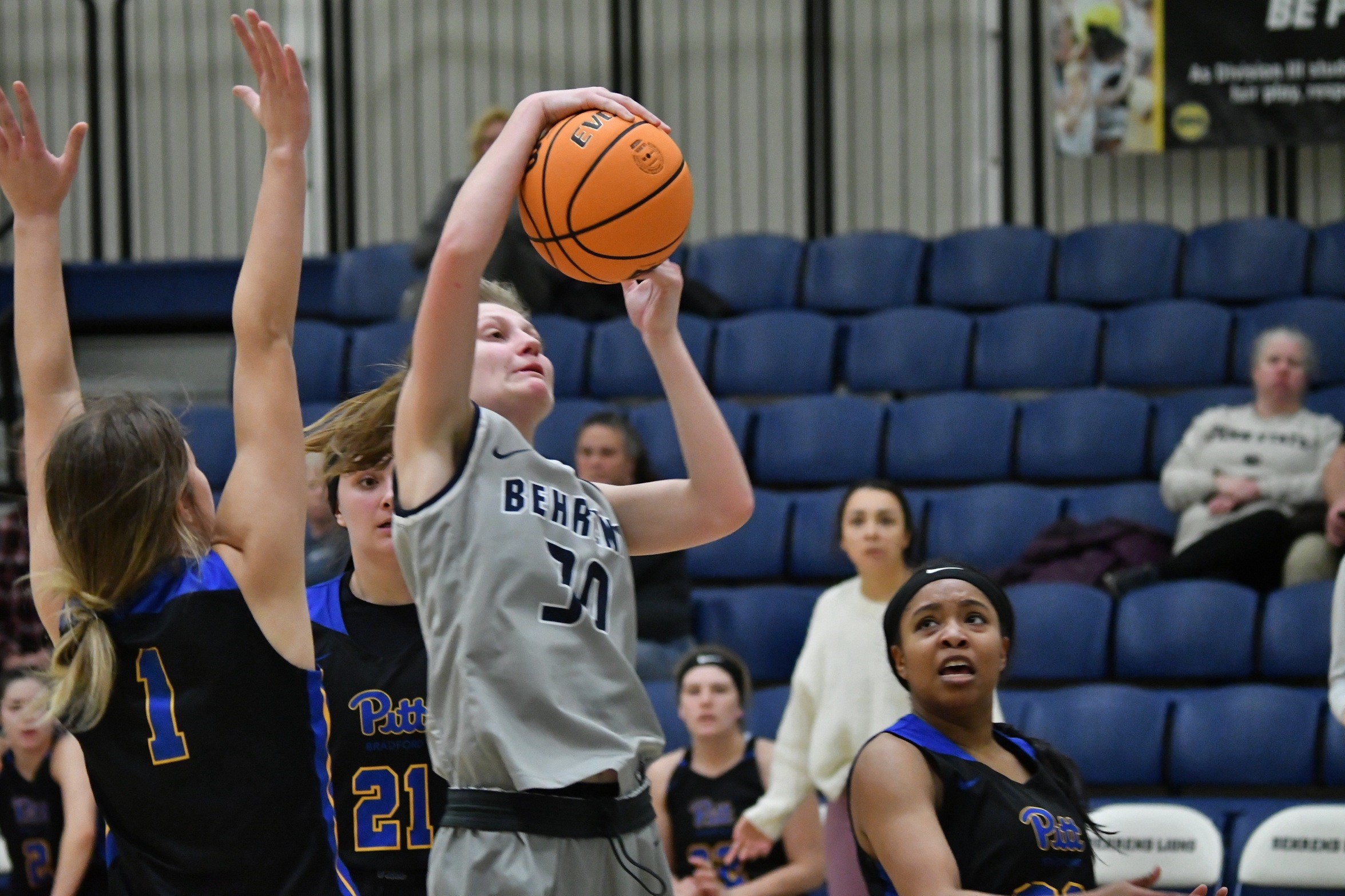 A member of the Penn State Behrend women's basketball team shoots the ball.