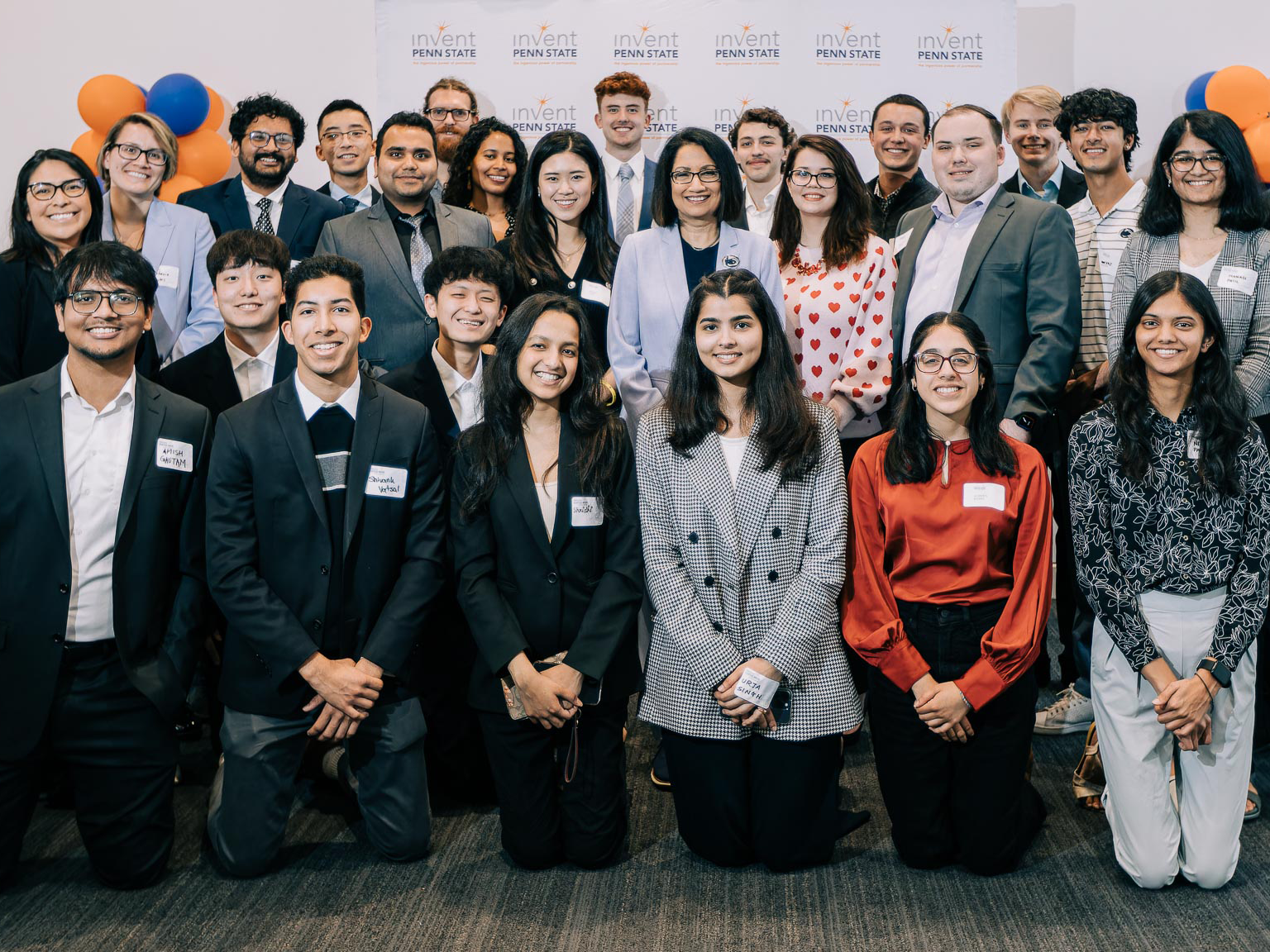 Student founders standing with President Neeli Bendapudi