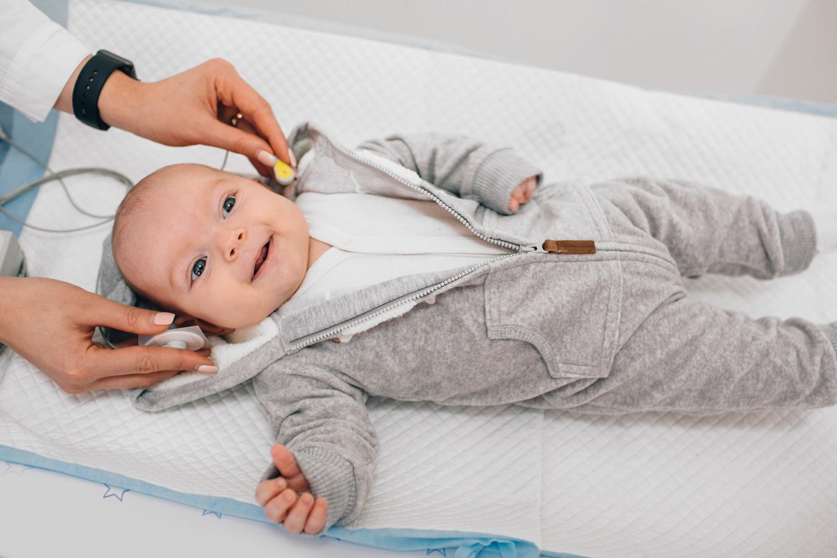 A baby receives a hearing test.