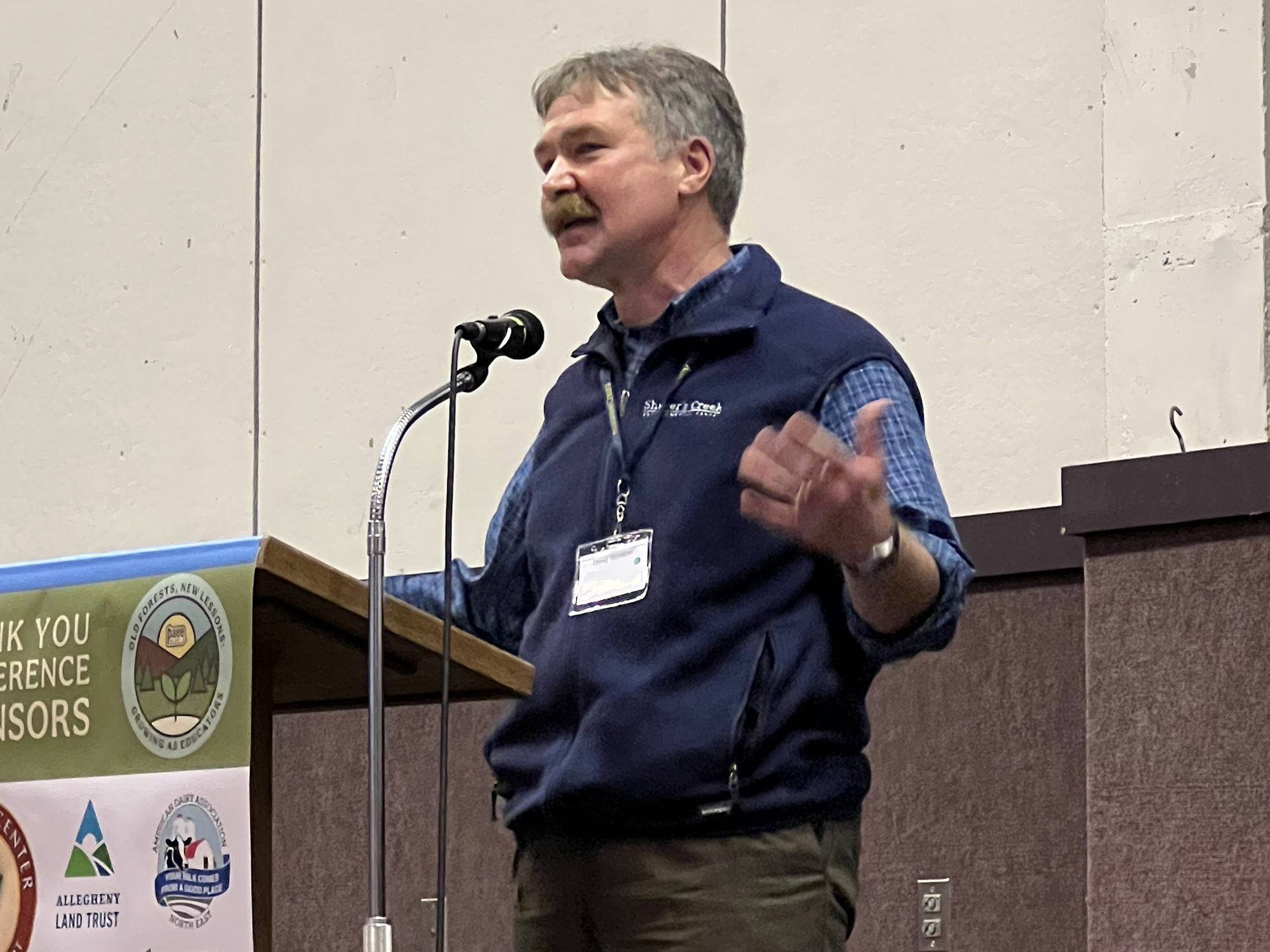 Doug Wentzel speaking at a podium