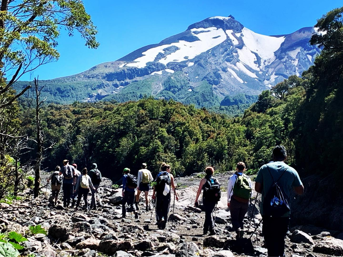 A group of college students hiking through the South American mountains