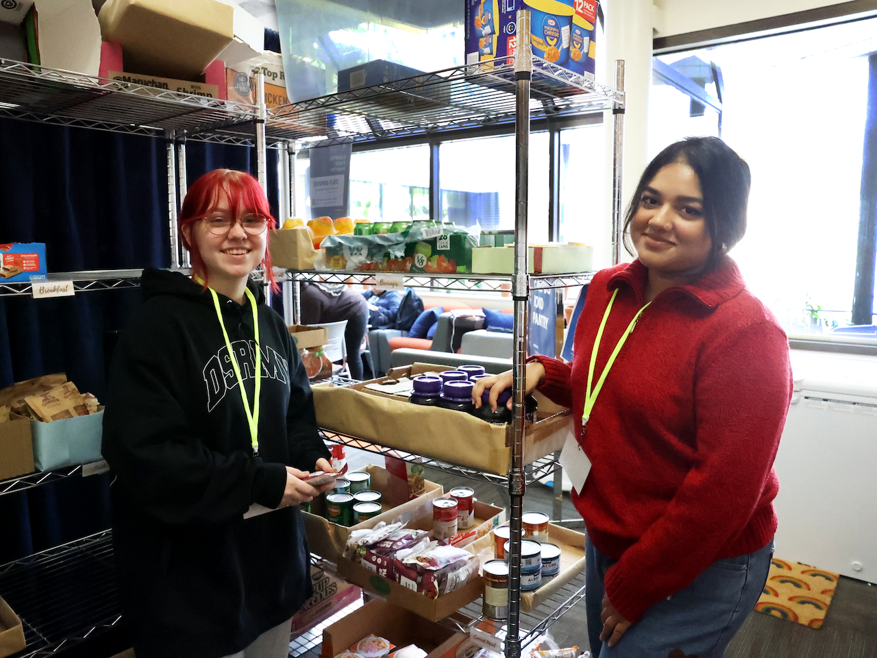 Students standing in front of the Center for Social Impact's food pantry