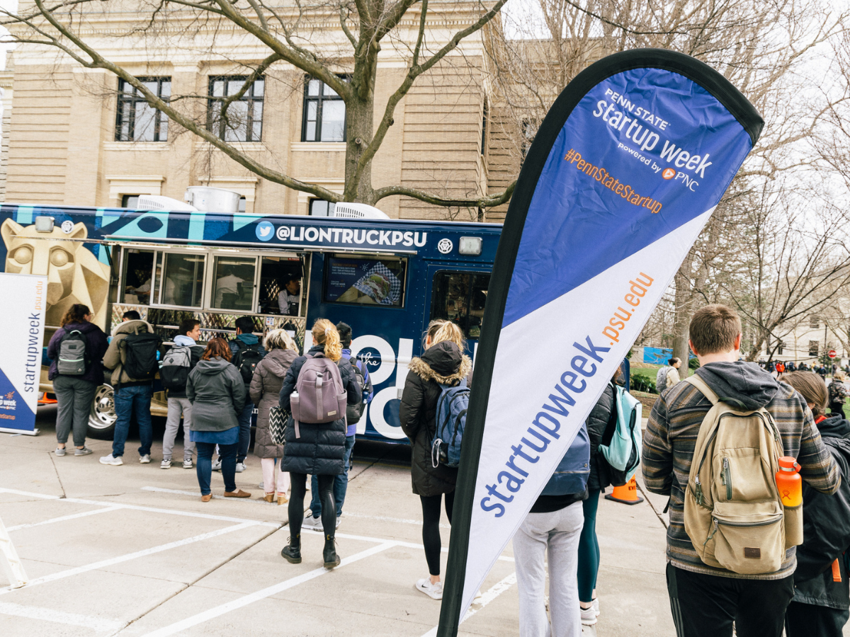 students stand in line at Rolling Lion food truck at 2022 Startup Week powered by PNC