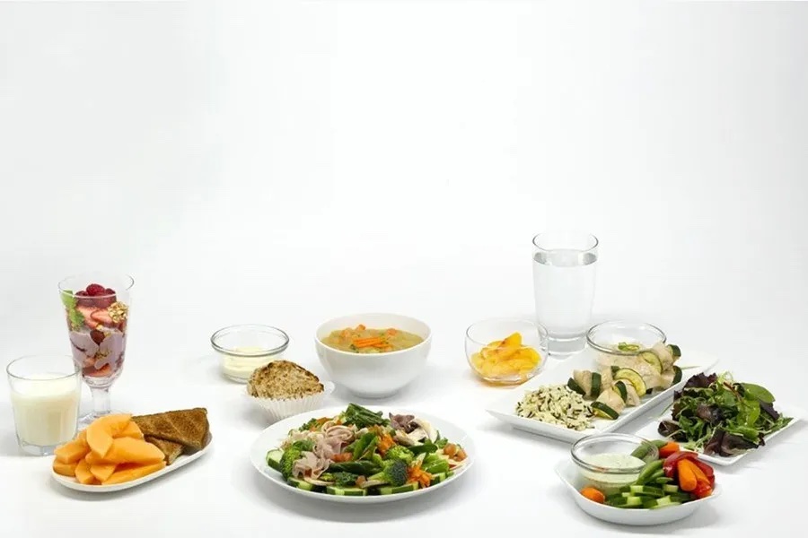 a variety of healthy foods on white plates