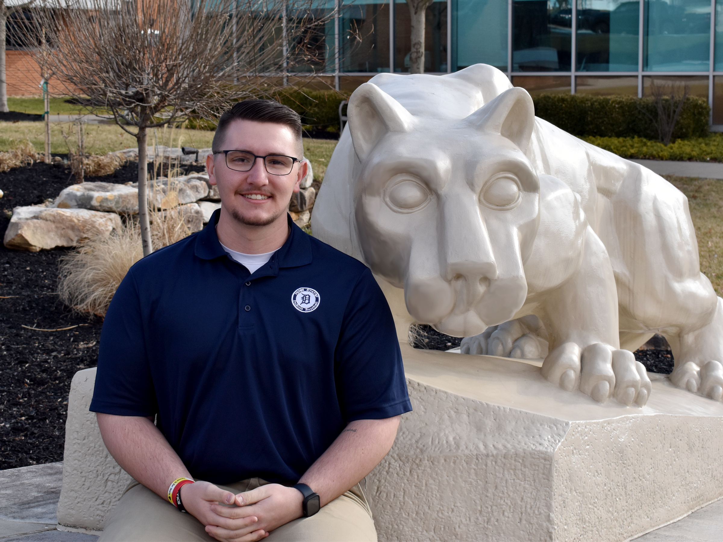 Lukas Salvo with the Lion Shrine on the campus of Penn State DuBois