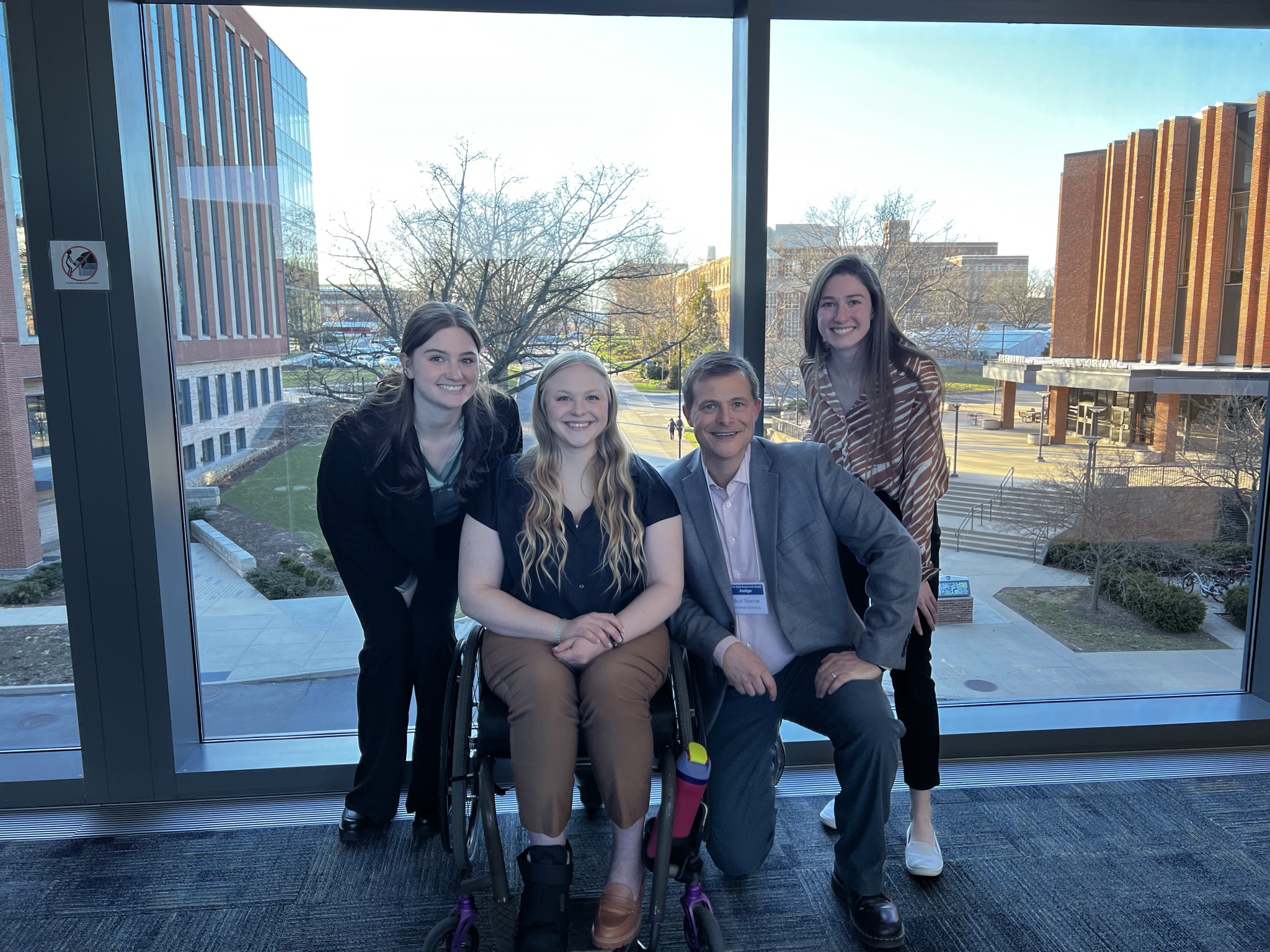 Burt Stanier attends the Gamma Sigma Delta poster competition with students Sarah Wolff, Siera Hall and Mady Dailey.