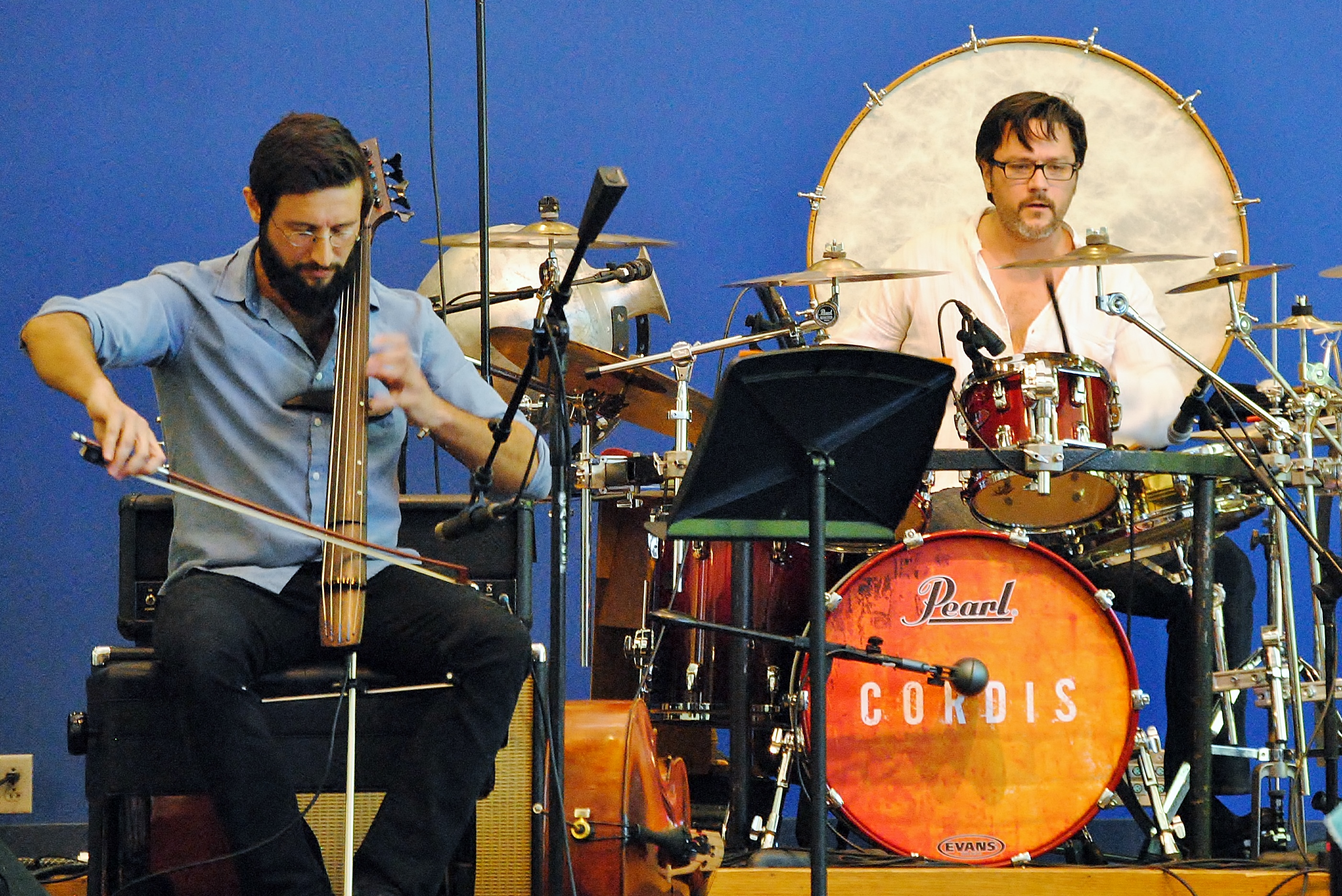 A cellist and drummer perform on state in McGarvey Commons at Penn State Behrend.