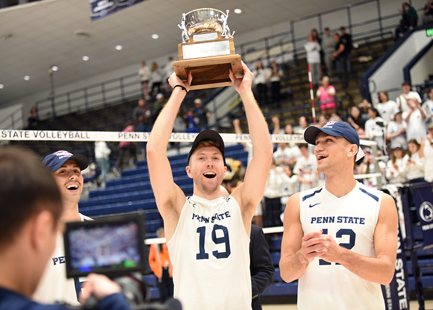 Player holds up trophy