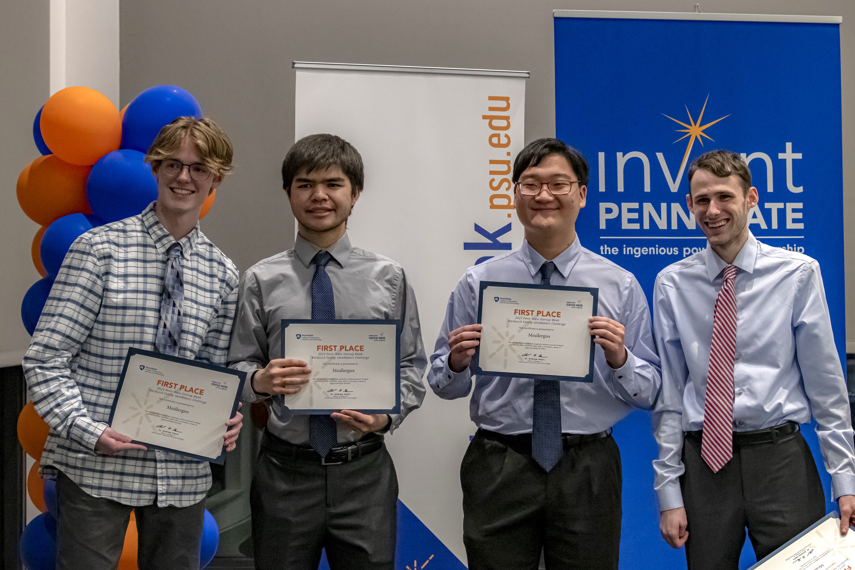 Four male students hold certificates showing they won the Bardusch Family Ideamakers Challenge.