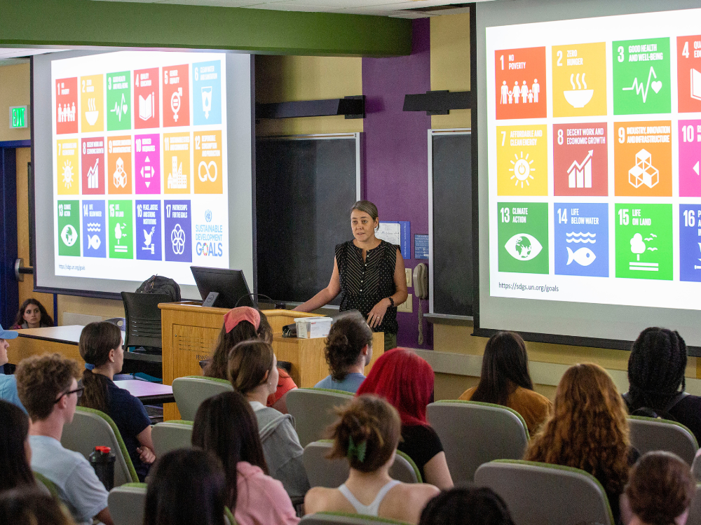 Laurel Pearson, associate teaching professor of anthropology, gives the Liberal Arts First-Year Lecture from behind a podium on September 19, 2022.