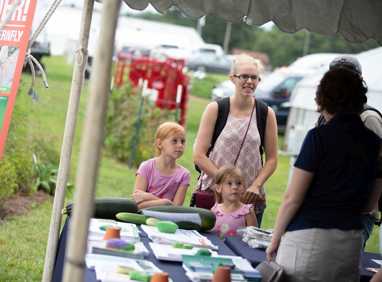 master gardener answers family's questions at Ag Progress Days