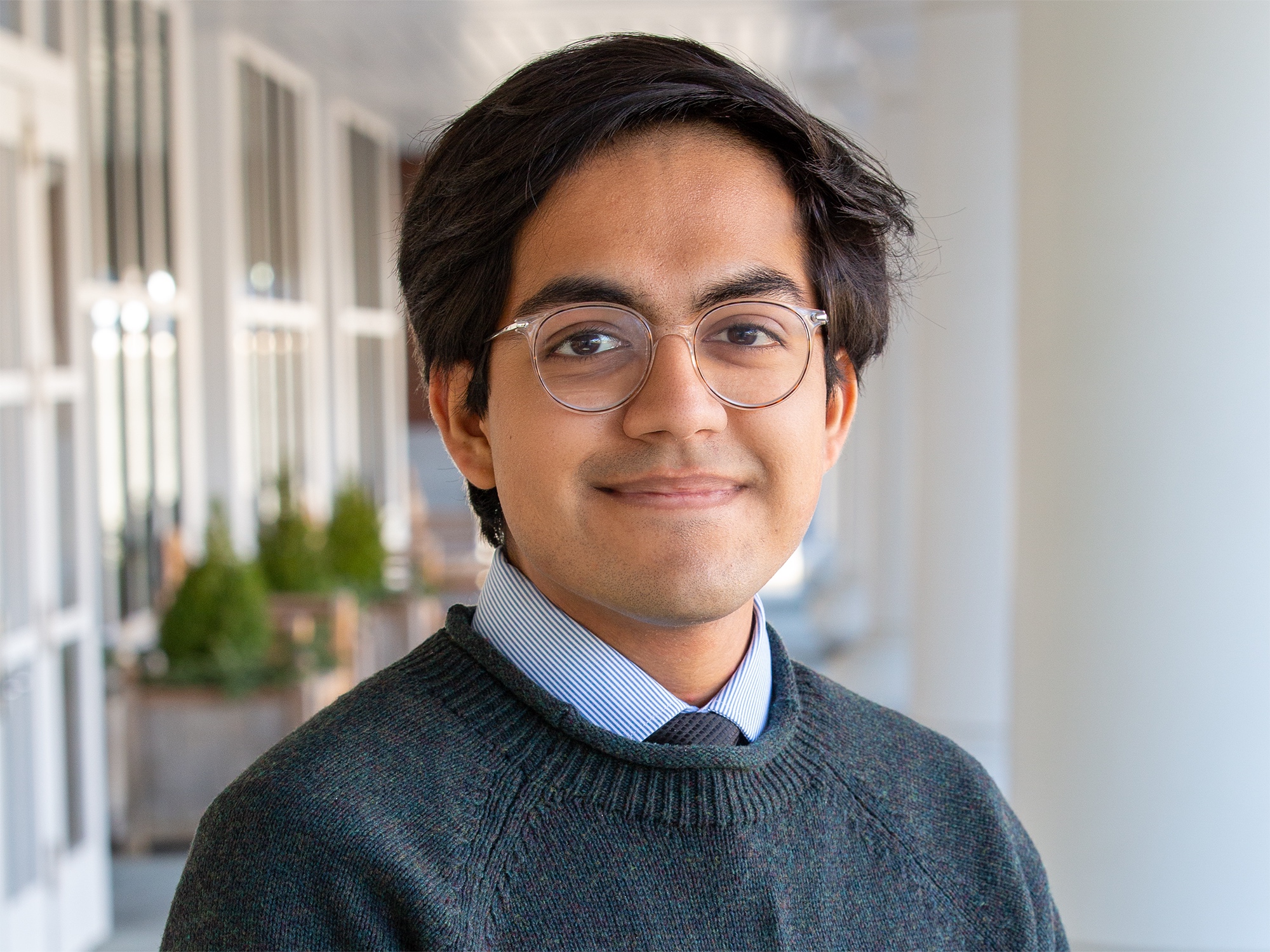 Taran Samarth stands outside the Hintz Family Alumni Center at Penn State University Park