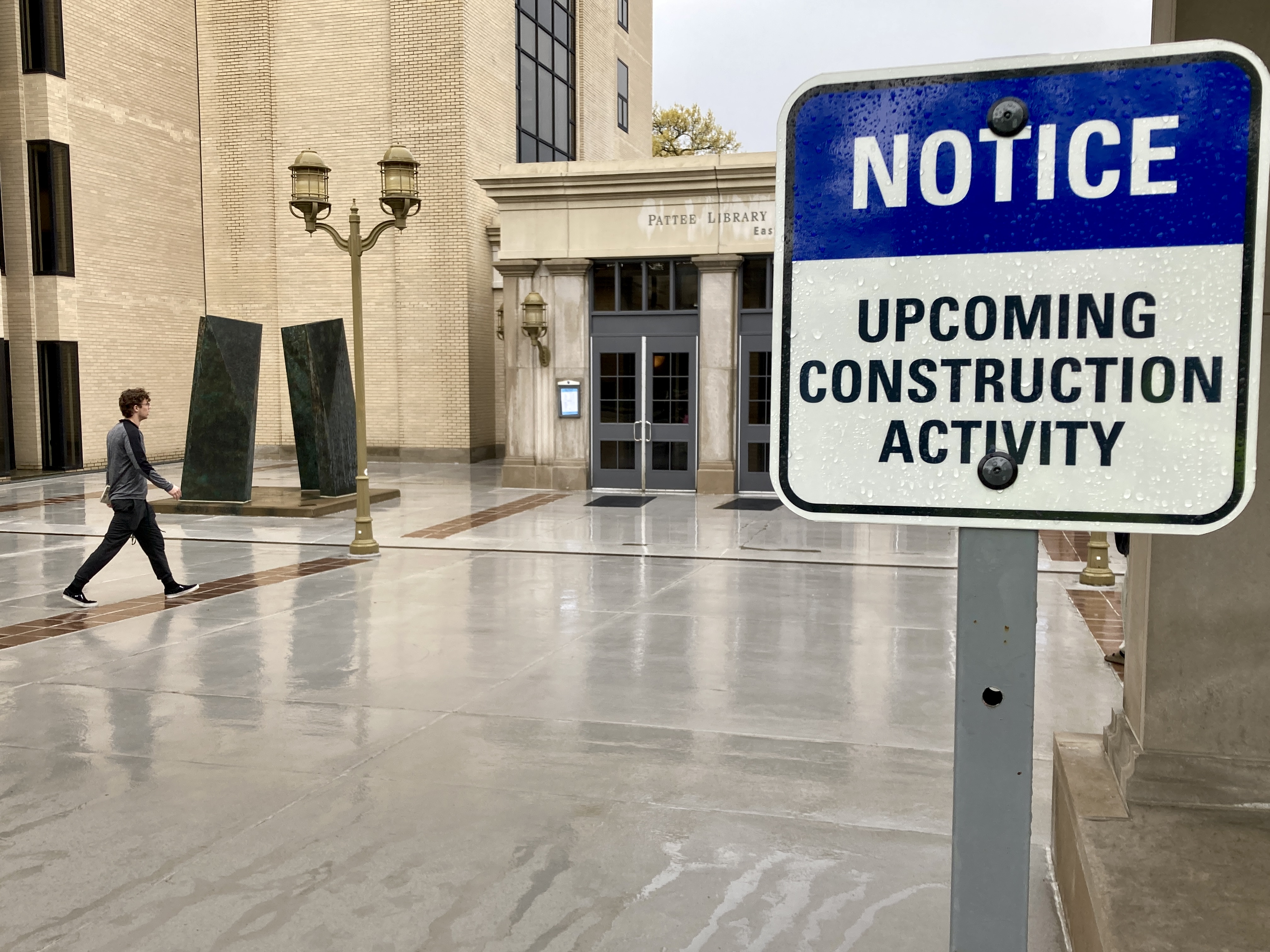 Construction sign in front of building