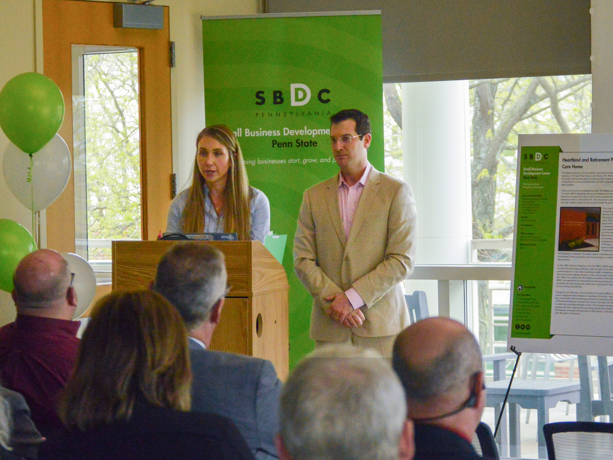 Penn State SBDC clients speaking at a podium