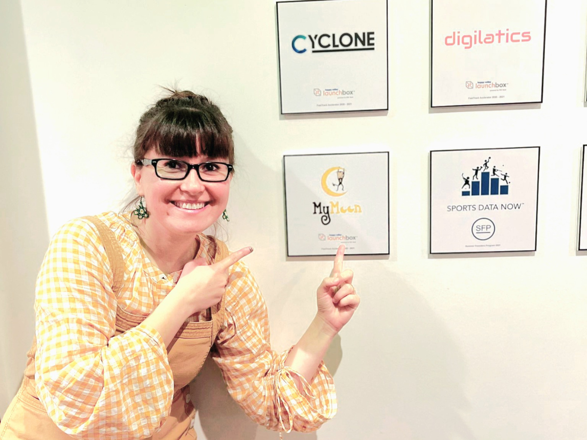 Münire Bozdemir poses in front of her startup's plaque at Happy Valley LaunchBox powered by PNC Bank.