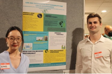 Linuo "Noah" Yang and Cade Ciarrocca stand in front of a research poster