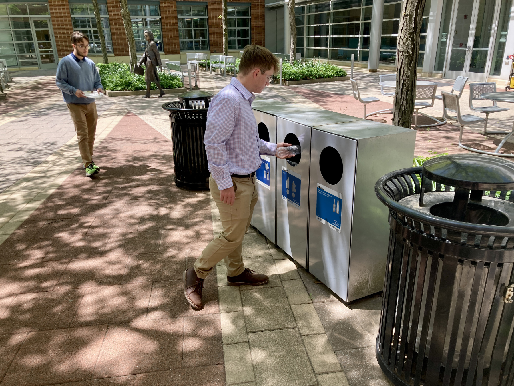 Student recycles a plastic bottle