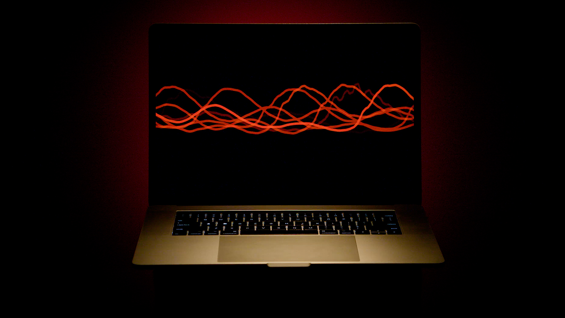 A laptop computer with a blank screen interrupted across the middle by wavy red lines