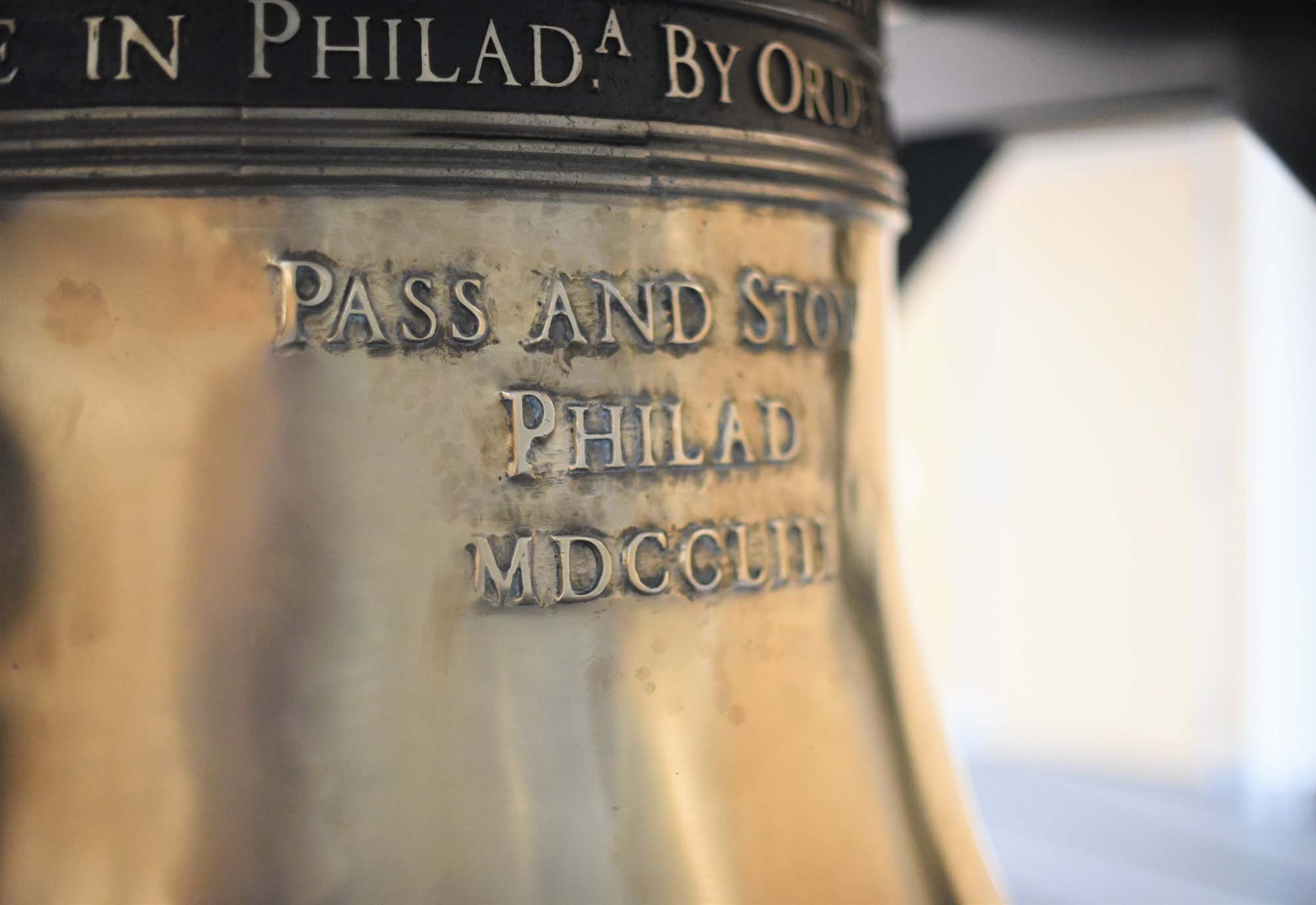 A close-up of a replica of the Liberty Bell