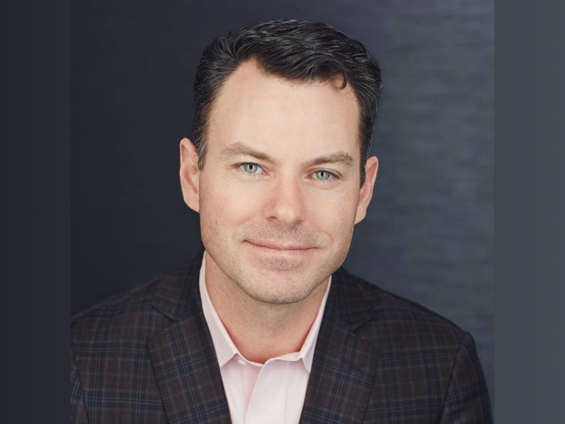 head shot of person wearing sport jacket