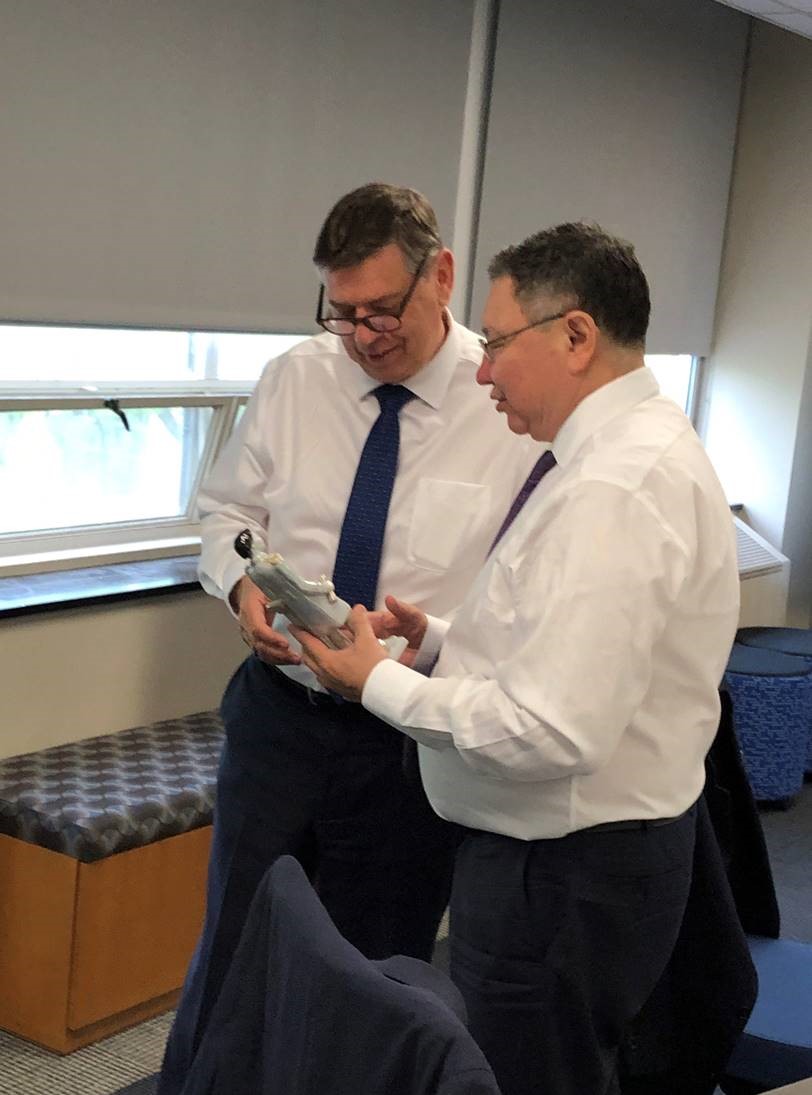 Two men shaking hands in an office