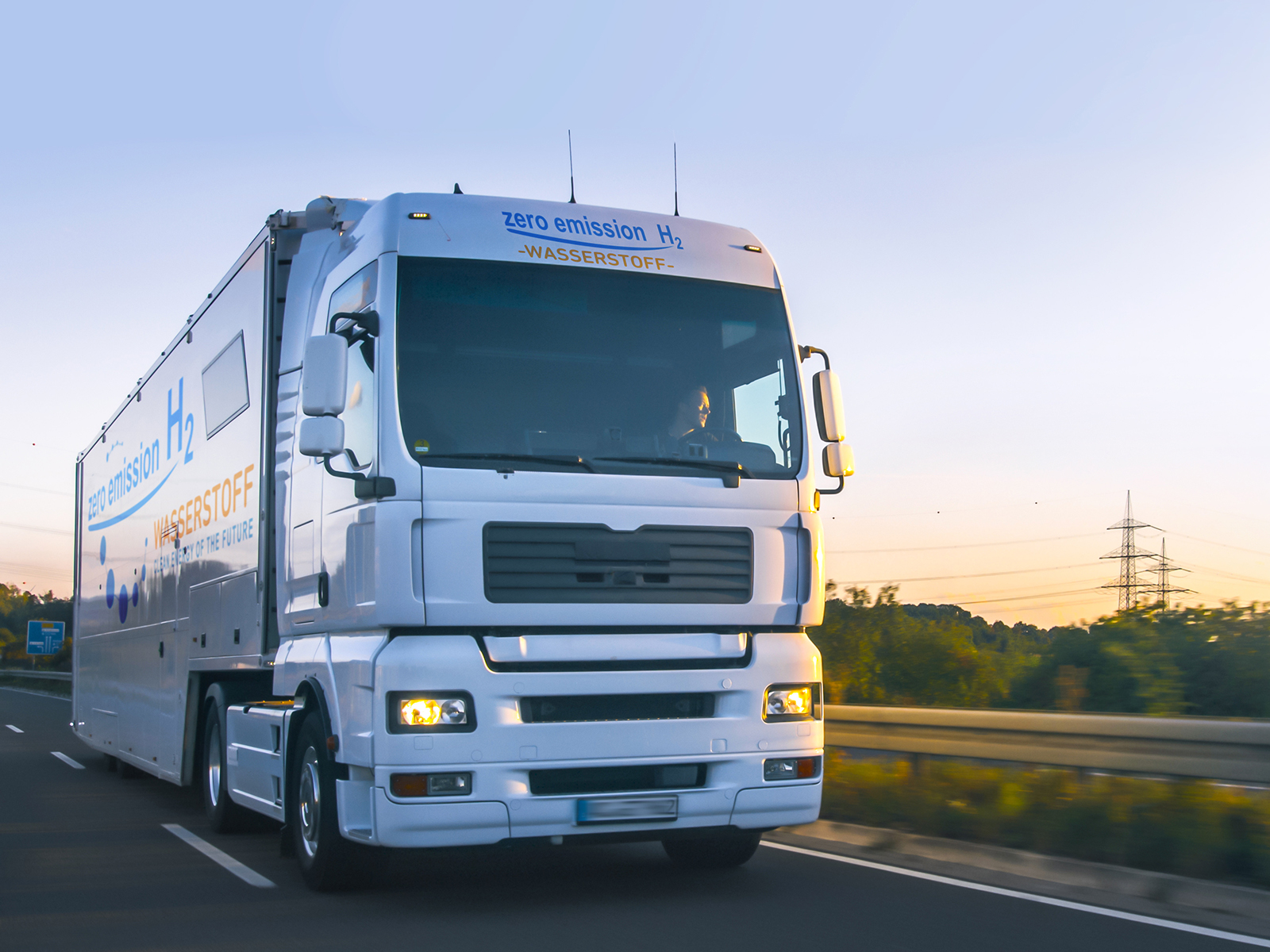 a hydrogen-powered tractor trailer driving on a highway