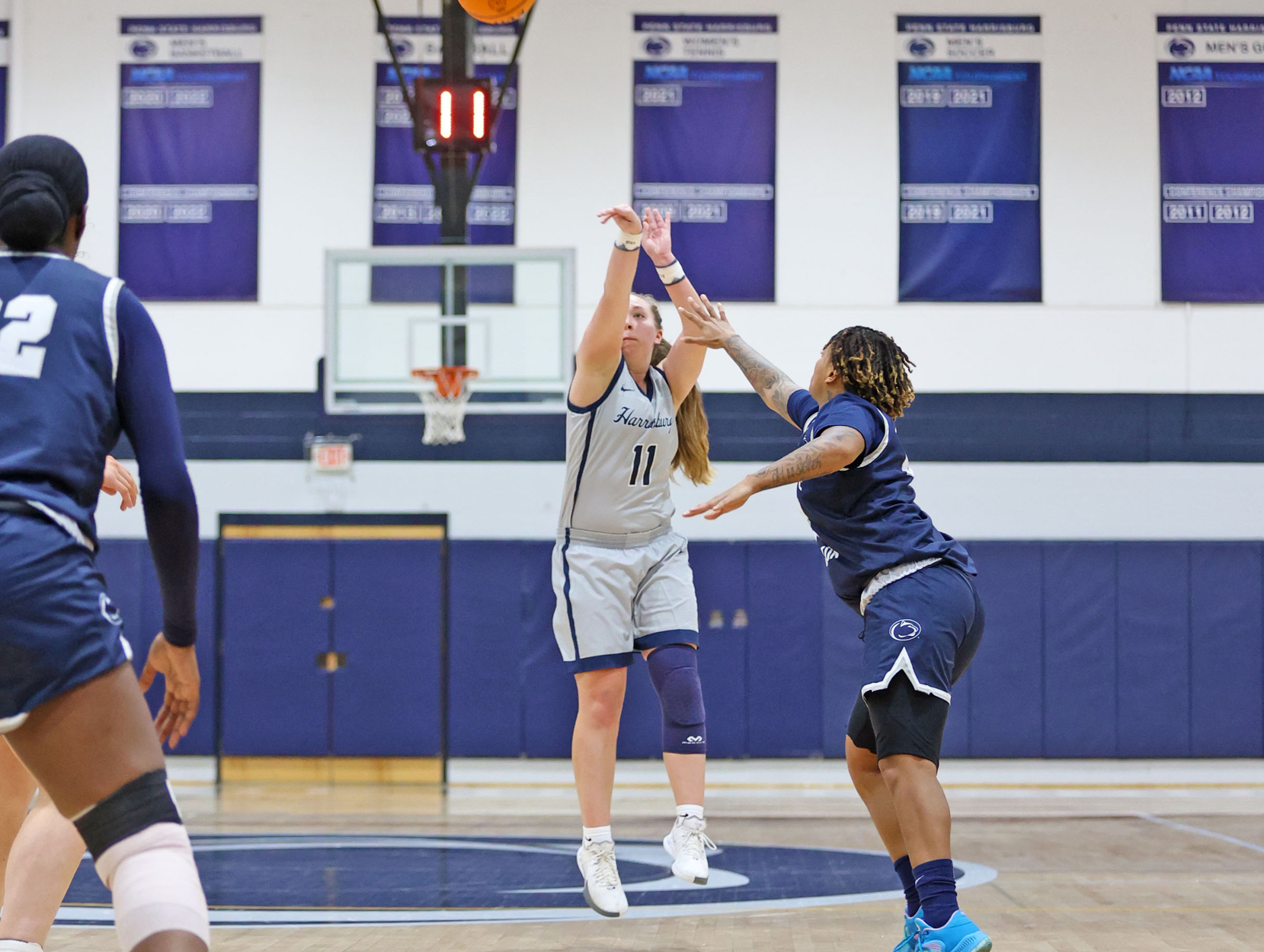 Kendis Butler, a Penn State Harrisburg women's basketball player, shoots a 3-pointer during a game