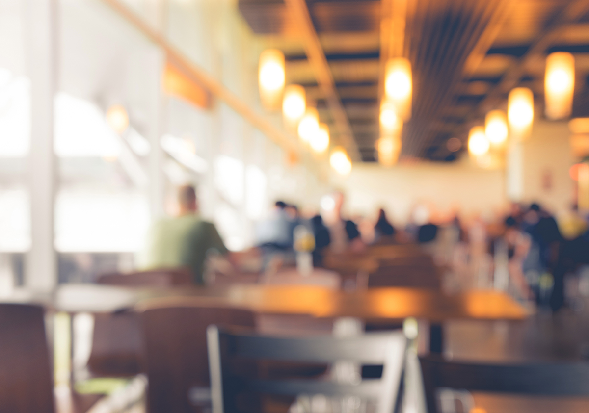 stock photo of restaurant with people and objects in the blurred background 