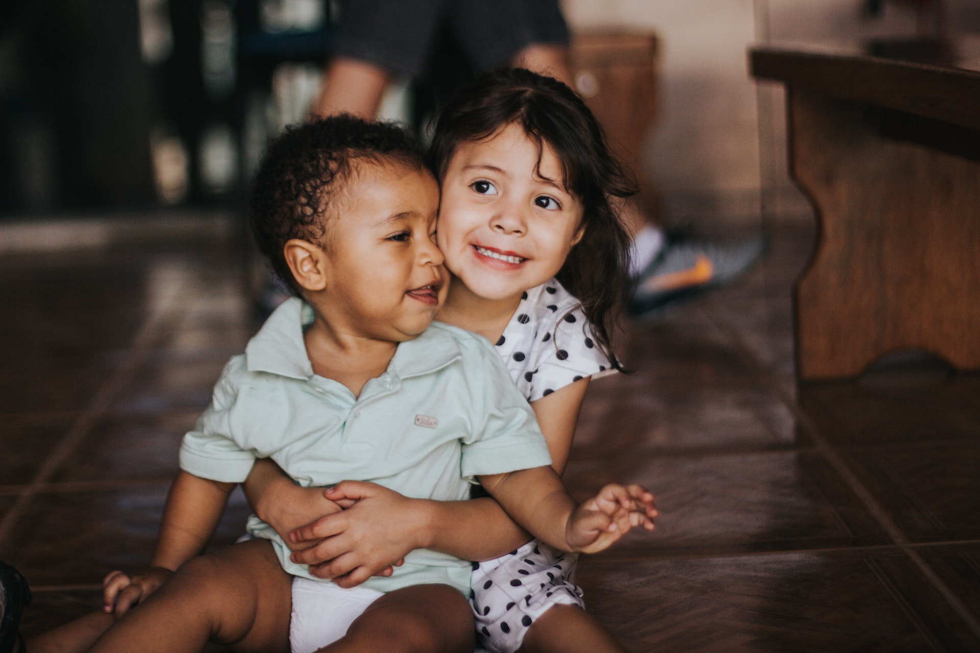 two young children hugging