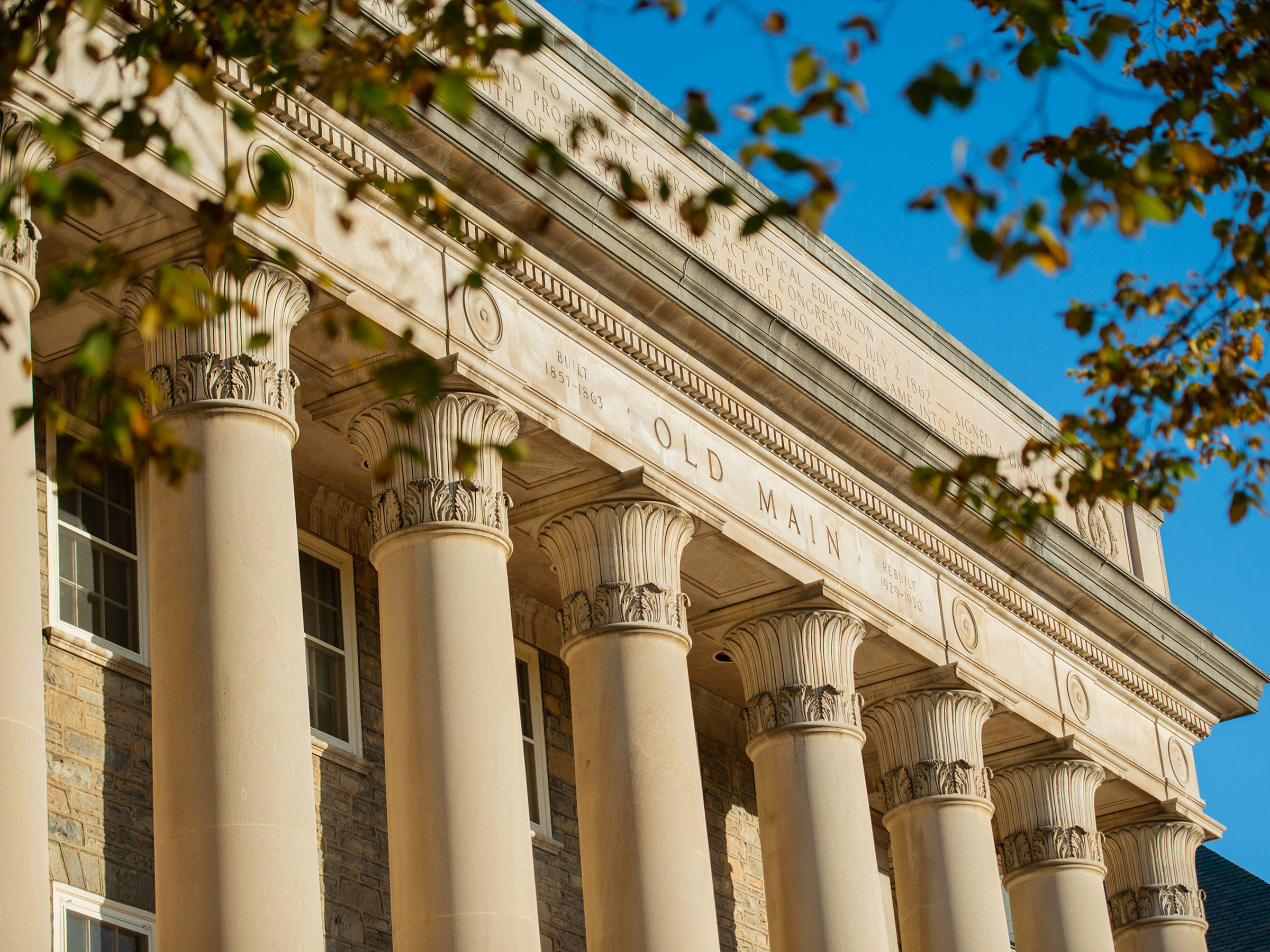 the exterior of old main at sunrise