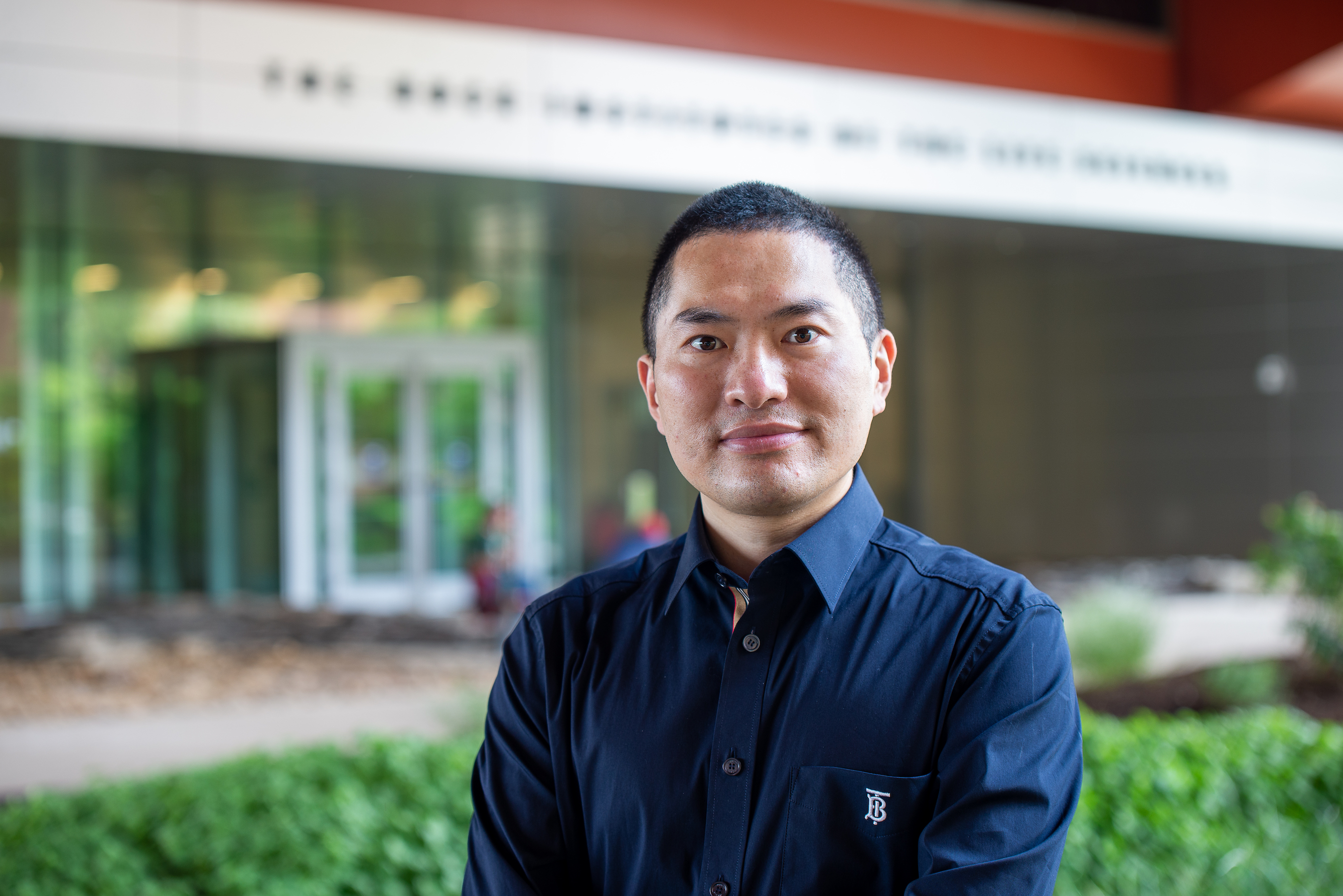 Lance Lian in the front of the Huck Institutes of the Life Sciences.