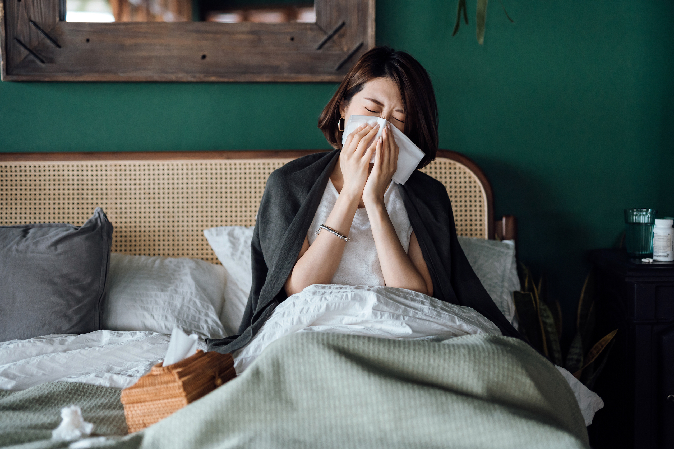 Woman sick in bed