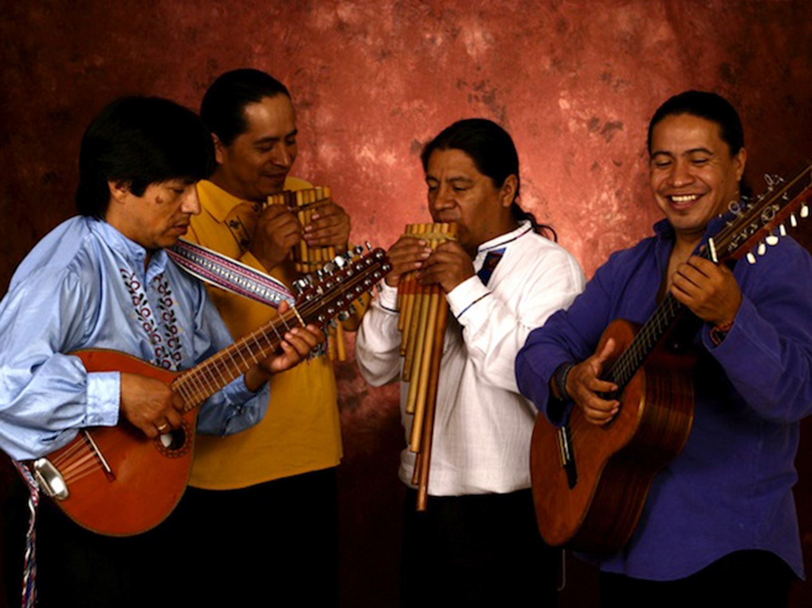 Four musicians with their handmade instruments