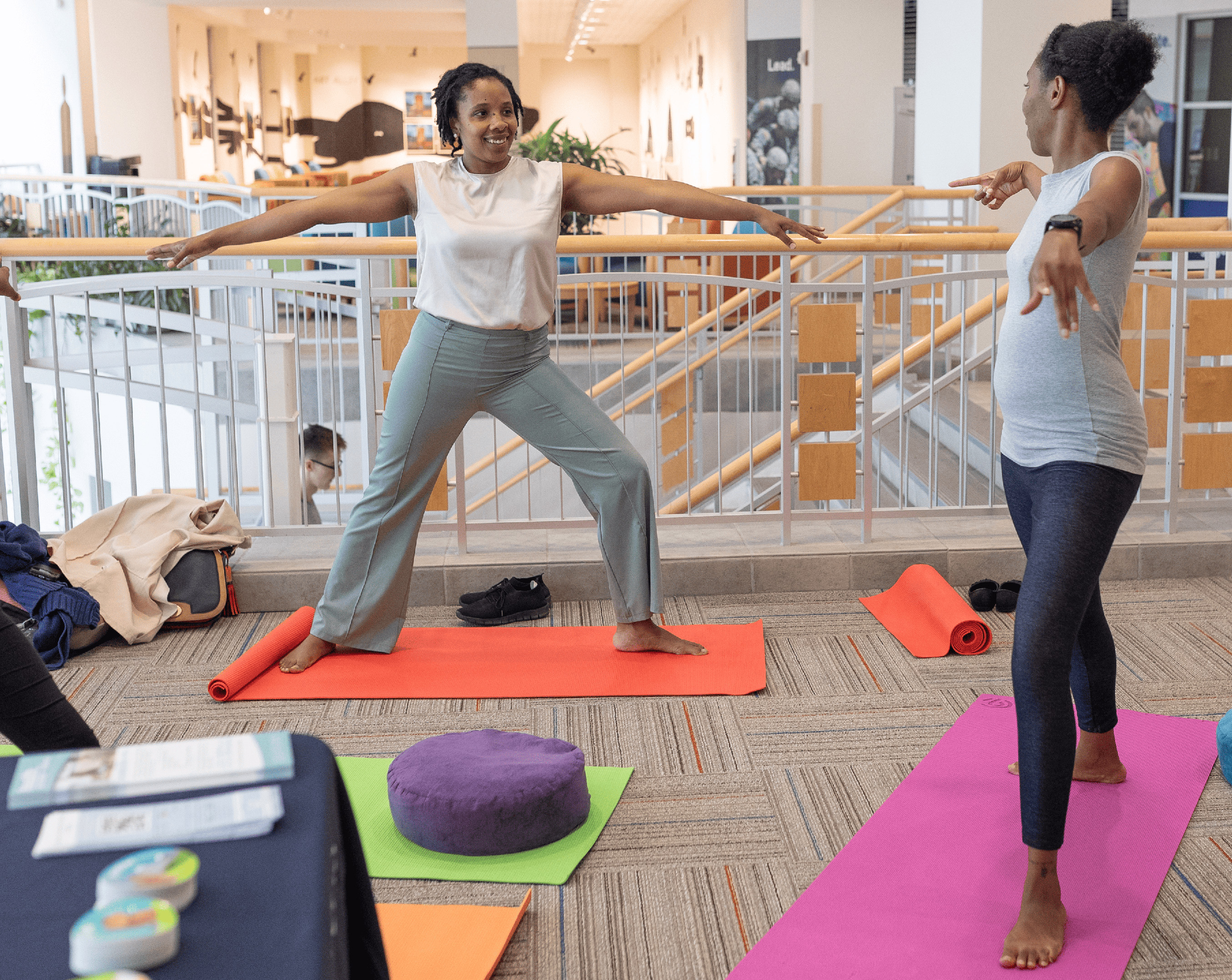 Two young ladies doing yoga poses.