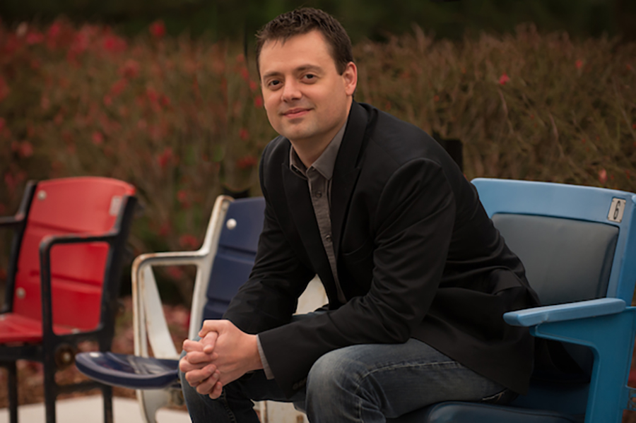 Ryan Hockensmith seated and smiling 