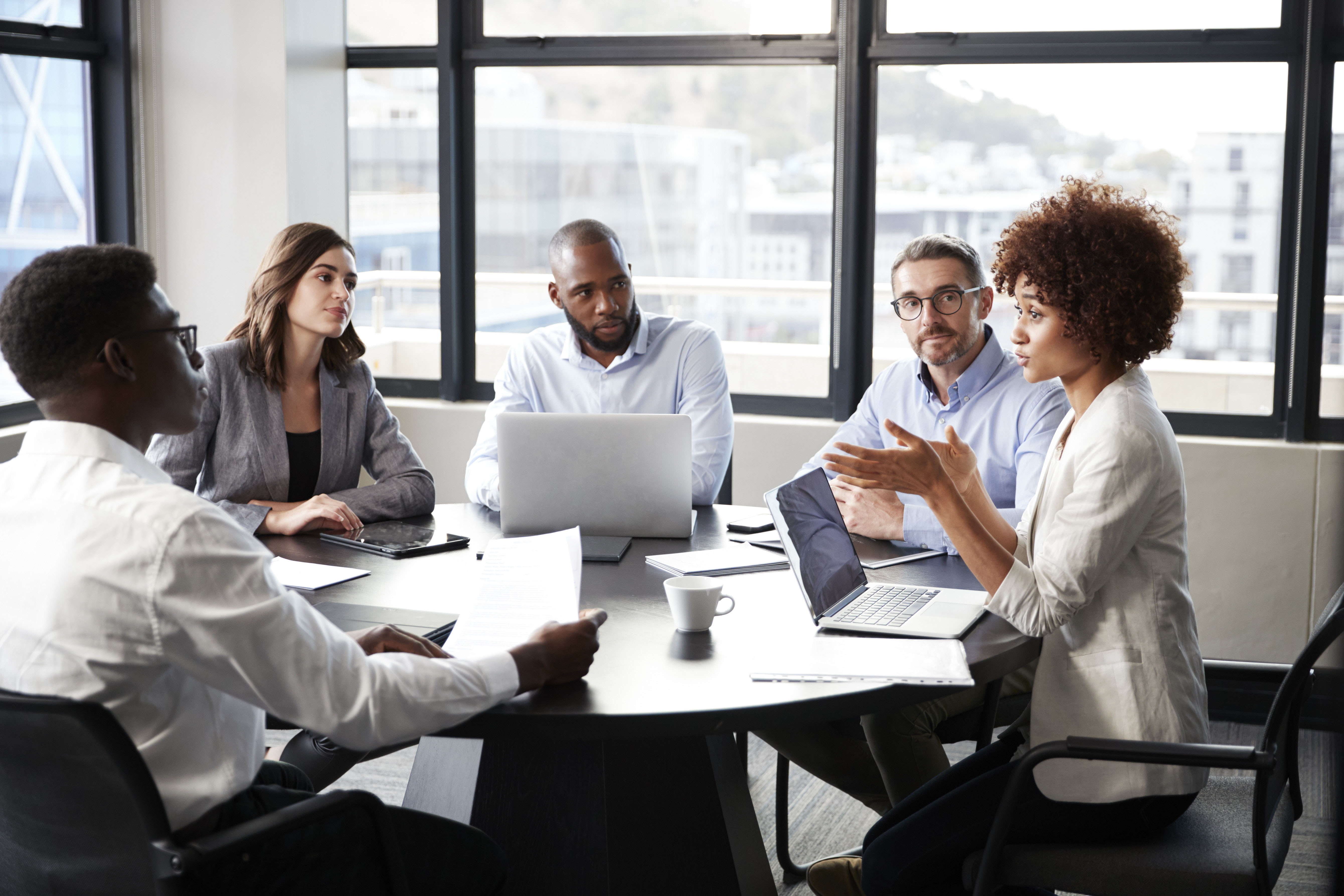 five people at business meeting