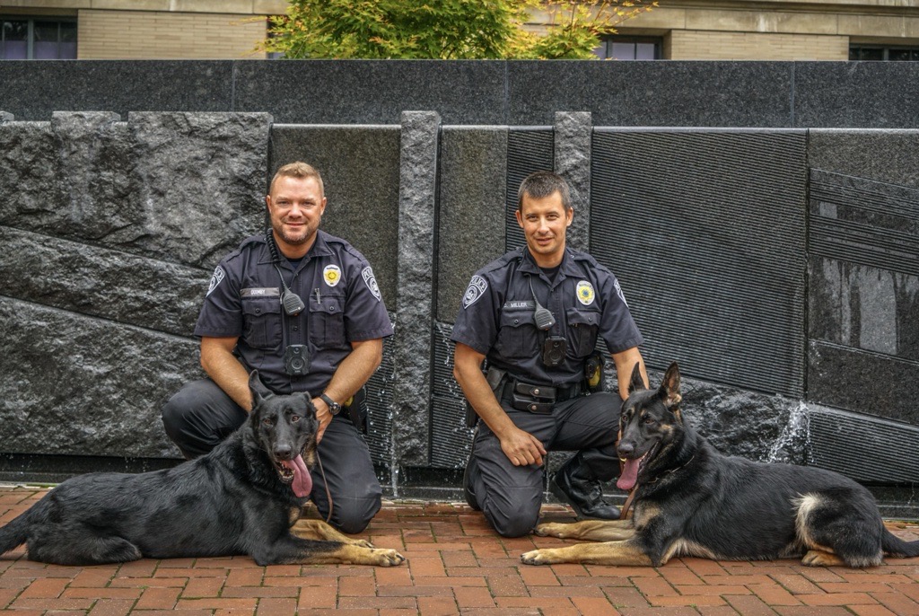 Penn State University Police Officers Josh Quimby and Dustin Miller with K9 Officers Bo and Zain at University Park.