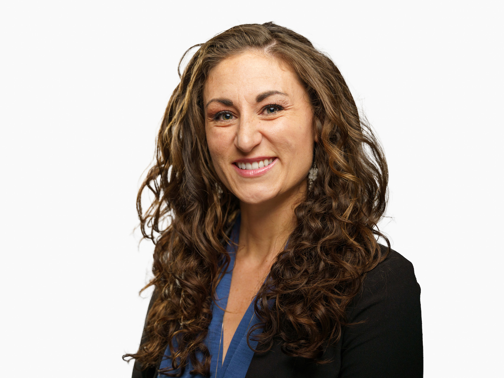 Laura Gamble smiles for a professional headshot against a plain white background. 