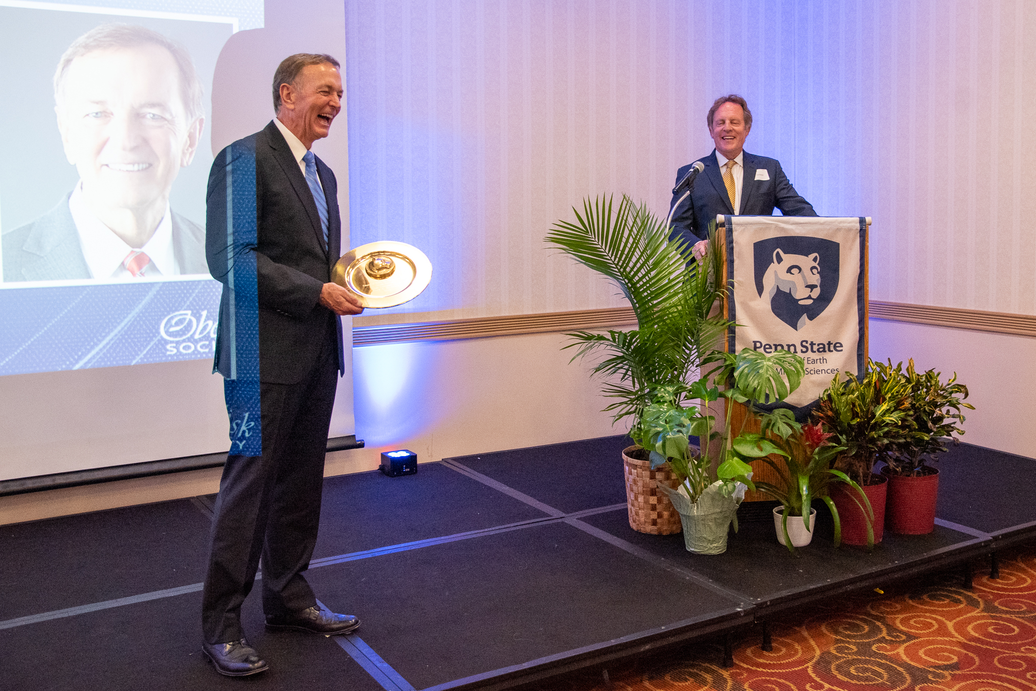 Jerry Berkebile accepts an award from EMS Dean Lee Kump