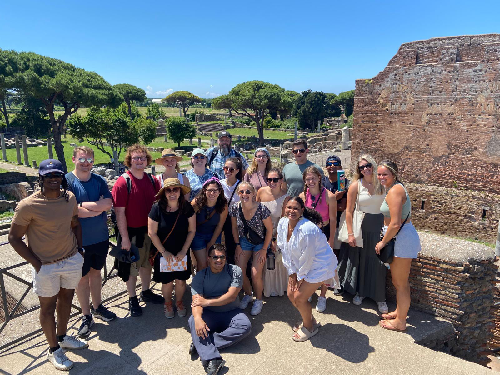 Liberal Arts students and faculty pose for a photo in Ostia–the Roman port city.