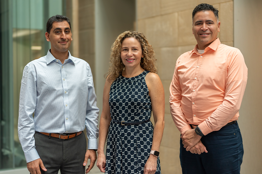 Hamid Emami-Meybodi,  Zuleima Karpyn and Luis Ayala standing in Steidle Building 