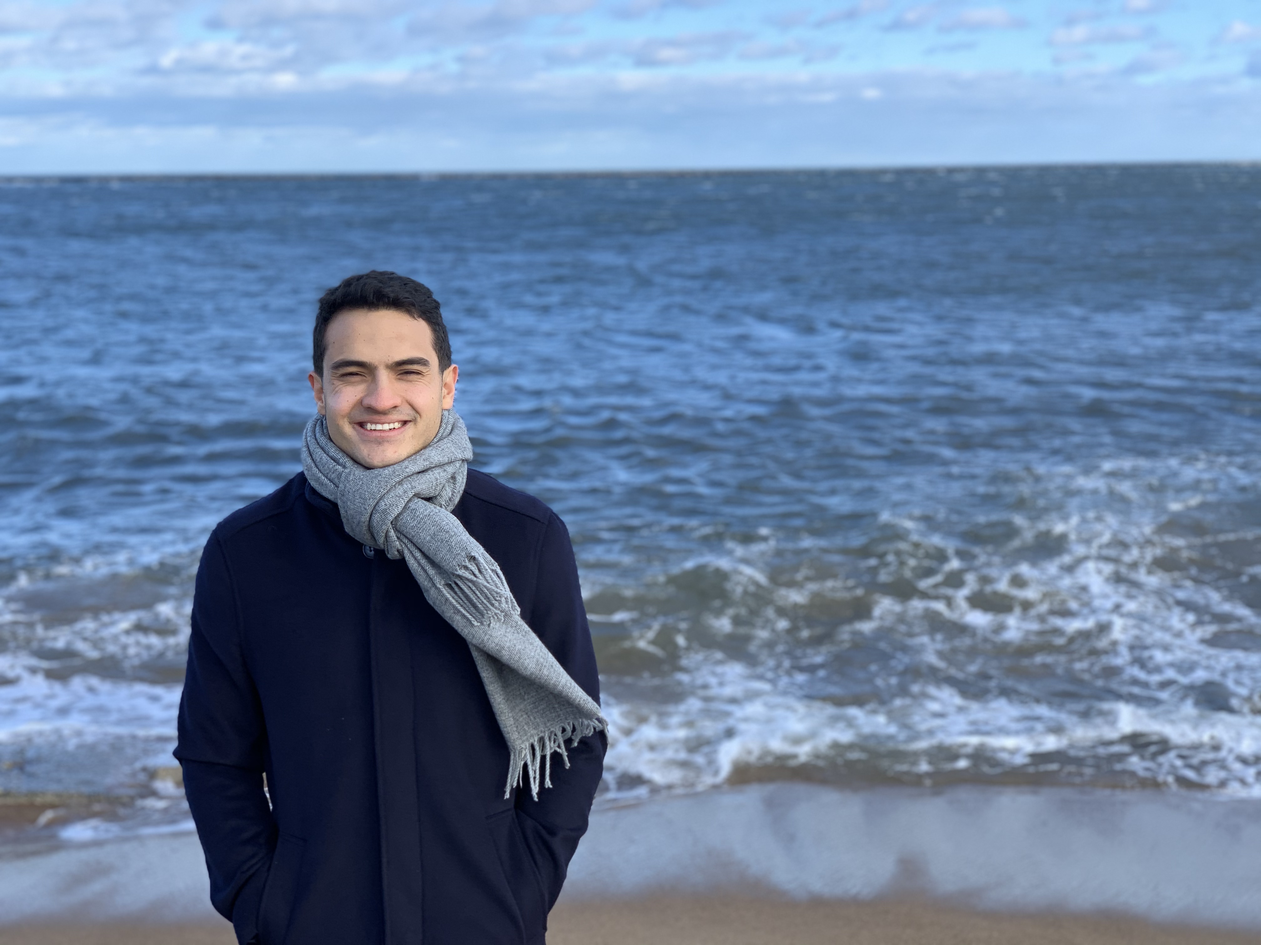 A man standing by a beach